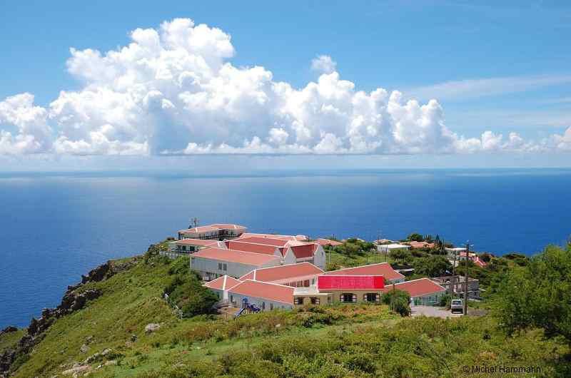 f-Saba-rises-majestically-from-her-clear-azure-waters-stretching-her-summit-to-caress-the-clouds.jpg