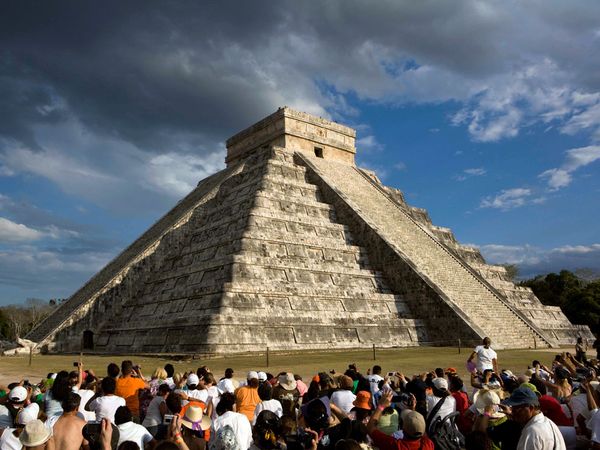 People-sitting-around-Maya-pyramid.jpg