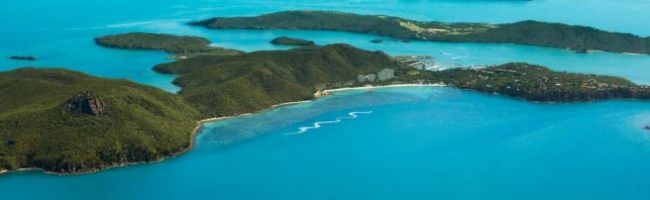 A-View-of-Hamilton-Island-from-the-Sky-Loading-940x198.jpg