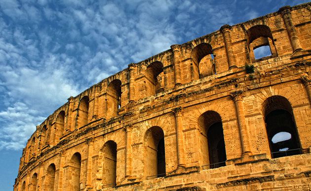 The-walls-of-the-mighty-Roman-amphitheatre-of-El-Djem-dwarf-the-surrounding-modern-town.jpg