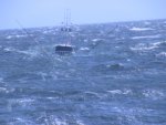 The-fishing-vessel-Wahoo-almost-dissapears-beneath-a-swell-while-in-tow.jpg